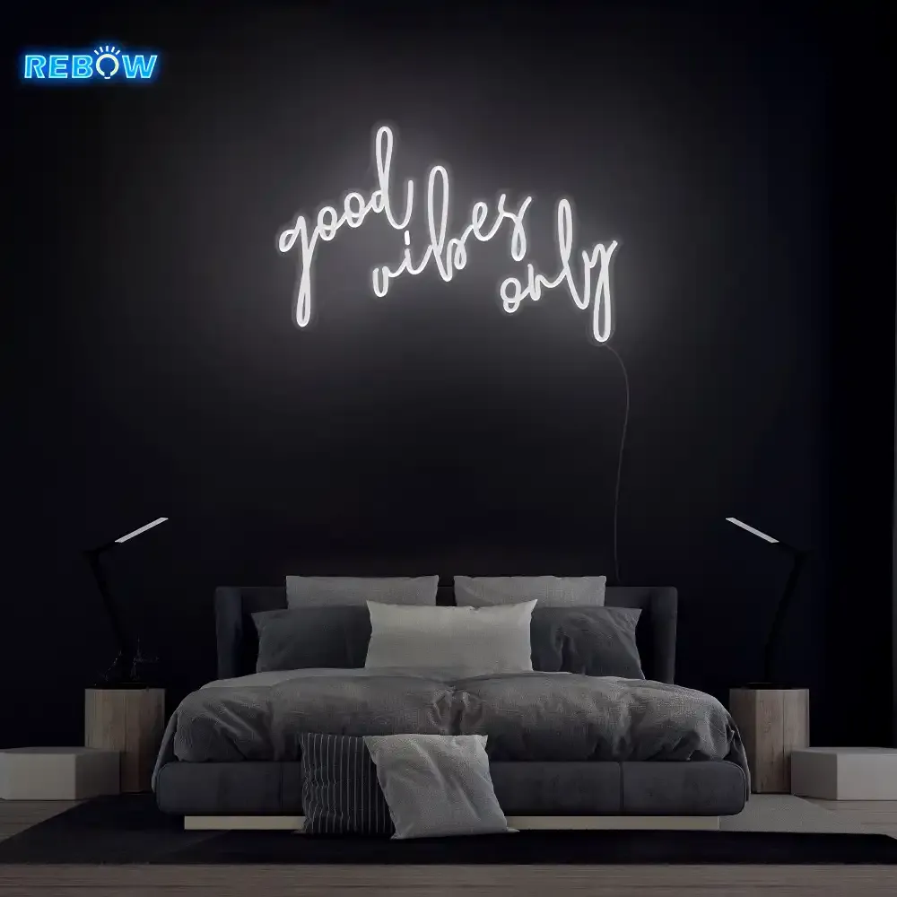 A script neon sign used as soft bedroom light