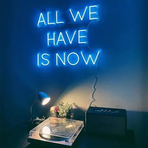 Blue illuminated lettering in an interior setting